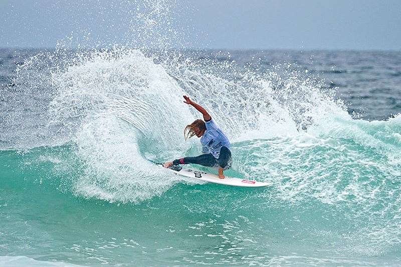 Jake Sylvester putting the power back into competitive surfing with a trademark tail slide. Photo by ASP/Will Hayden-Smith