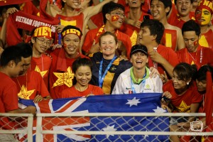 Sarah Groube (R) and Cheryl Downes (L) join the Vietnam cheer squad | Photo: Emily Mogic Photography