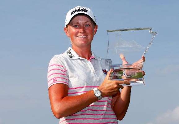 Stacy Lewis poses with the trophy after winning the Walmart NW Arkansas Championship. PHOTO: Getty Images