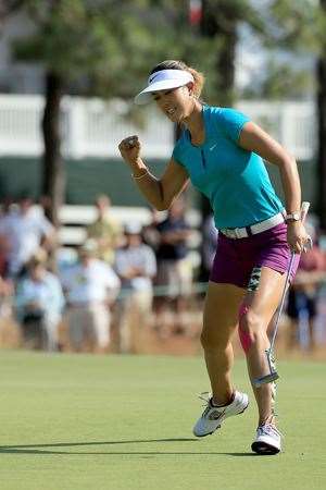 Michelle Wie celebrates holing a crucial birdie putt at the par-3 17th hole during the final round. PHOTO: Getty Images