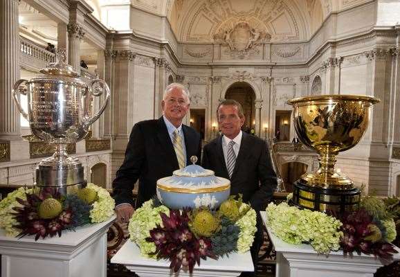 PGA of America President Ted Bishop (left) and PGA Tour Commissioner Tim Finchem stand next to tournament trophies at the TPC Harding Park announcement. PHOTO: Getty Images.