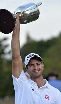 Adam Scott holds the Joe Kirkwood Cup aloft after winning the Australian PGA last year. PHOTO: Getty Images
