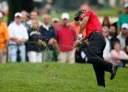 Tiger Woods hits out of the rough on the 2nd hole during the final round. PHOTO: Getty Images
