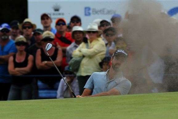 Nick Cullen blasts out of a bunker on the 18th hole to set up his win. He described the shot as the best of his career. PHOTO: Getty Images