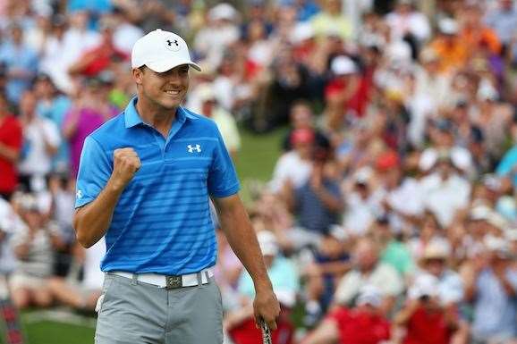Jordan Spieth punches the air after making birdie at the final hole for a course record 63 and the win. PHOTO: Getty Images