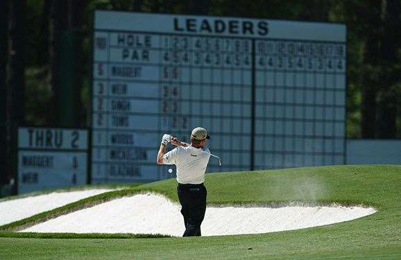 Jeff Maggert tries to play out of a fairway bunker on the 3rd hole and the ball hits the lip and hits him on the ricochet, all but costing him the 2003 Masters. PHOTO: Getty Images
