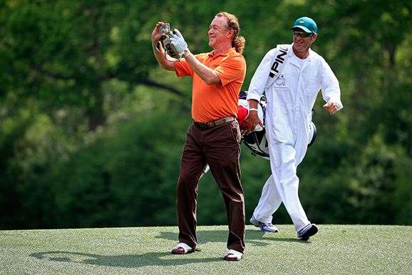 Miguel Angel Jimenez takes a photo with his phone as he walks during a practice round. PHOTO: Getty Images