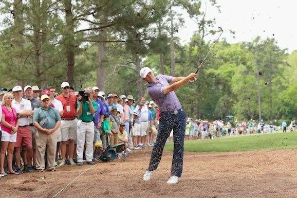 Spieth plays a shot from the pine needles on the 14th hole en route to a six under 66. PHOTO: Getty Images.
