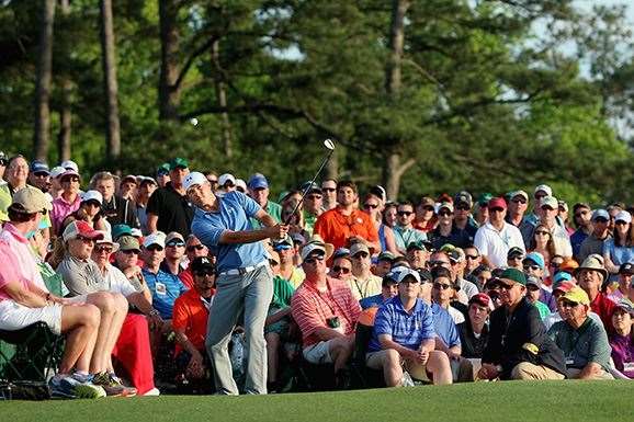 Jordan Spieth plays a remarkable pitch shot from wide of the 18th green to set up a close par putt. PHOTO: Getty Images.