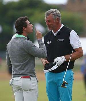 Despite the generation gap, Northern Ireland duo Darren Clarke and World No.1 Rory McIlroy love taking a few dollars from each other in a practice round. PHOTO: Getty Images.