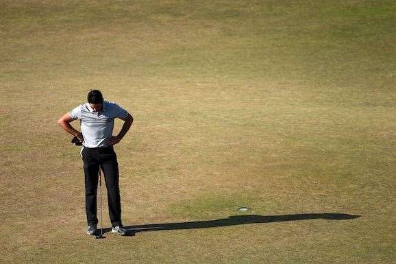 Jason Day finishes his third round with a birdie but was still feeling the effects of vertigo. (Photo by Ross Kinnaird/Getty Images)