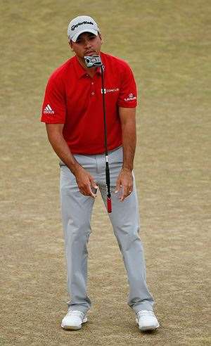 Jason Day reacts to missing his putt on the 18th green. PHOTO: Getty Images.