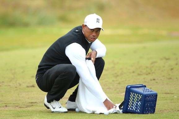 Tiger Woods pours out some balls on the range before another long practice session. PHOTO: Andrew Redington/Getty Images.
