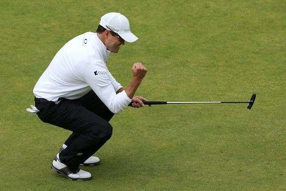 Zach Johnson celebrates a birdie putt on the 18th green to set the clubhouse mark at 15 under. PHOTO: Photo by Jan Kruger/Getty Images.