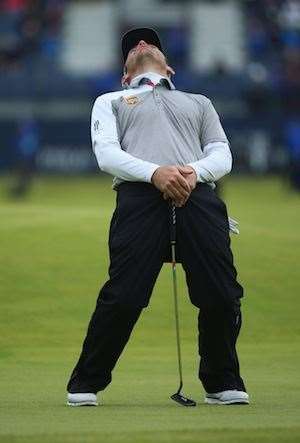 Louis Oosthuizen misses his par putt on the 17th hole in the playoff. PHOTO: Andrew Redington/Getty Images.