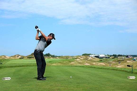 Matt Jones hits his drive on the 11th hole during his best opening round in a major championship. PHOTO: Photo by Andrew Redington/Getty Images.
