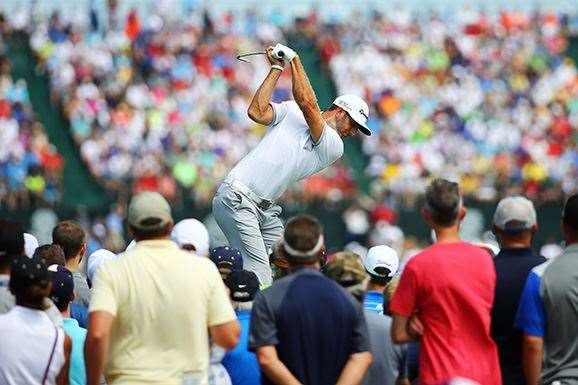 For the third time this year, Dustin Johnson has put his name at the top of the leaderboard early in a major. PHOTO: Richard Heathcote/Getty Images.