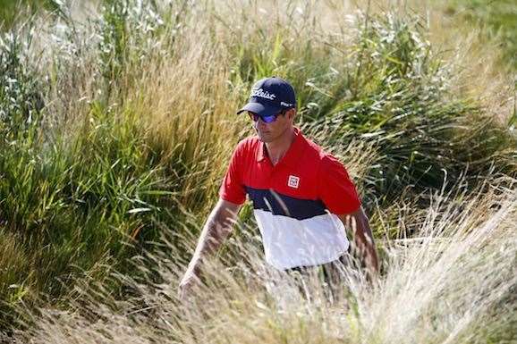 Adam Scott walks to his ball on the 14th hole, with the writing on the wall for his PGA campaign. He and five other Australians missed the cut. PHOTO: Jamie Squire/Getty Images.