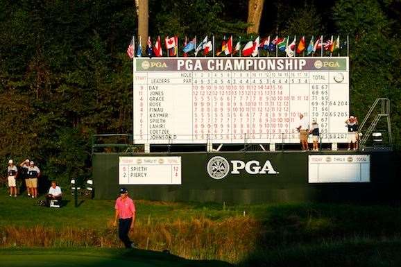 Spieth caught a glimpse of the leaderboard on 18 and knew he had to make his b birdie putt ... and he did. PHOTO: Jamie Squire/Getty Images.