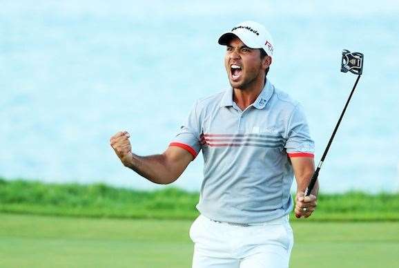 Jason Day pumps up the crowd after rolling in a birdie at the 17th hole. PHOTO: Andrew Redington/Getty Images.