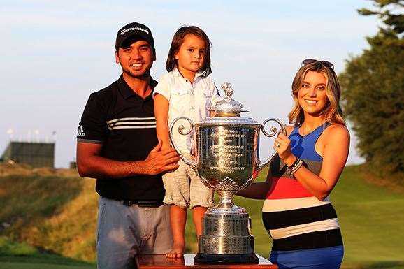 Jason Day poses with the Wanamaker trophy and his wife Ellie and son Dash after winning the 2015 PGA Championship. PHOTO: Andrew Redington/Getty Images.