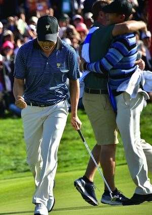Bae Sang-Moon and Danny Lee celebrate their win on the 18th hole. PHOTO: Jung Yeon-Ye/AFP. Getty Images.
