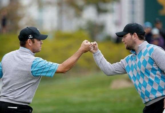 Branden Grace and Louis Oosthuizen celebrate after another birdie during the fourball session. PHOTO: Chung Sung-Jun/Getty Images.