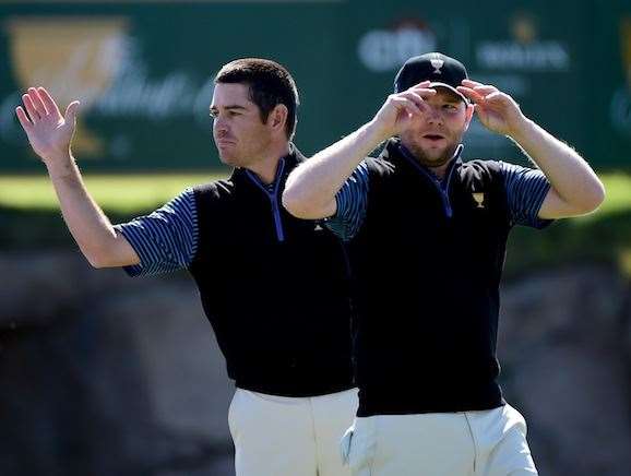 Branden Grace (right) and Louis Oosthuizen claimed a major scalp in beating Jordan Spieth and Dustin Johnson, to remain unbeaten in these matches. PHOTO: Harry How/Getty Images.