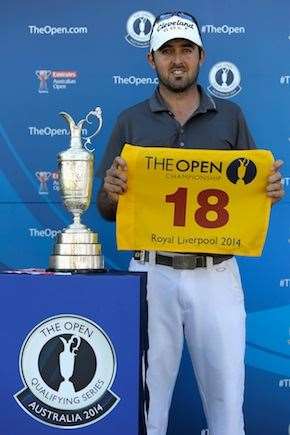 Rhein Gibson poses for a photo with his Championship flag after qualifing for the British Open during the Australian Open in 2013. PHOTO: Brett Hemmings/R&A/via Getty Images.