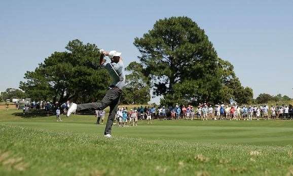 Ogilvy gets a little unorthodox with his second shot on the par-5 5th hole. PHOTO: Mark Metcalfe/Getty Images.