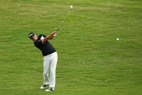 Matt Jones plays his approach shot on the 13th hole. PHOTO: Photo by Matt King/Getty Images.