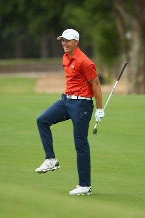 Spieth is all smiles after holing his approach shot for an eagle on the 17th hole. PHOTO: Mark Kolbe/Getty Images.