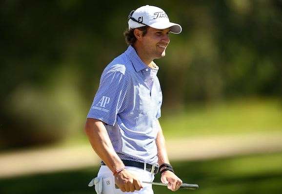 Peter Uihlein smiles after making birdie at the par-4 14th hole. PHOTO: Paul Kane/Getty Images.