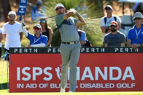 Rhein Gibson watches his tee shot on the 6th hole during the second round. PHOTO: Paul Kane/Getty Images.