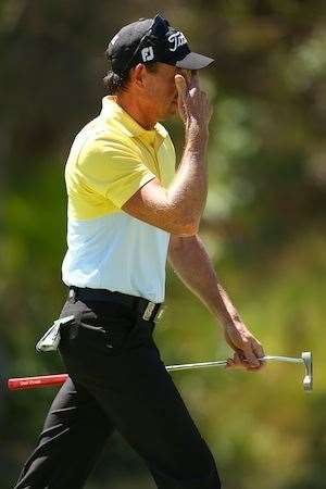 Brett Rumford reacts after missing a par putt early in his round. PHOTO: Paul Kane/Getty Images.