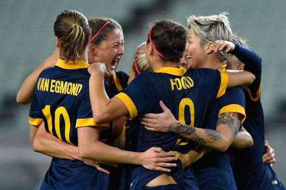 Matildas celebrate after qualification was assured. (Photo by Getty Images)