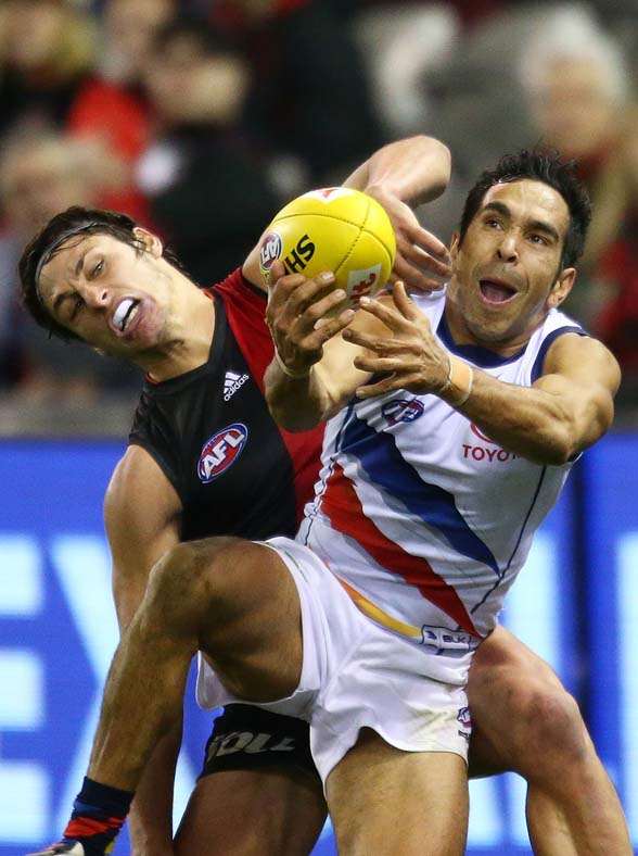 MELBOURNE, AUSTRALIA - AUGUST 15: Eddie Betts of the Adelaide Crows takes a mark in front of Mark Baguley of the Essendon Bombers during the round 20 AFL match between the Essendon Bombers and the Adelaide Crows at Etihad Stadium on August 15, 2015 in Melbourne, Australia. (Photo by Scott Barbour/Getty Images)