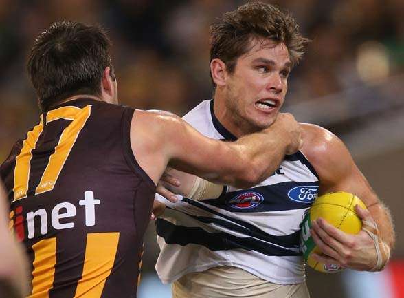 MELBOURNE, AUSTRALIA - AUGUST 15: Brian Lake of the Hawks tackles Tom Hawkins of the Cats during the round 20 AFL match between the Geelong Cats and the Hawthorn Hawks at Melbourne Cricket Ground on August 15, 2015 in Melbourne, Australia. (Photo by Michael Dodge/Getty Images)