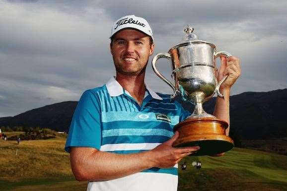 Griffin and the prestigious  New Zealand Open trophy. PHOTO: Hannah Peters/Getty Images.