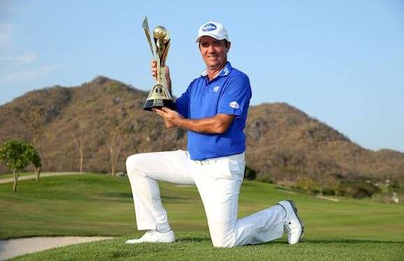 Scott Hend celebrates with his second European Tour trophy. PHOTO: Ian Walton/Getty Images.