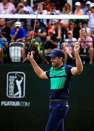 YES!! Charl Schwartzel celebrates after holing his par putt to win. PHOTO: Sam Greenwood/Getty Images.