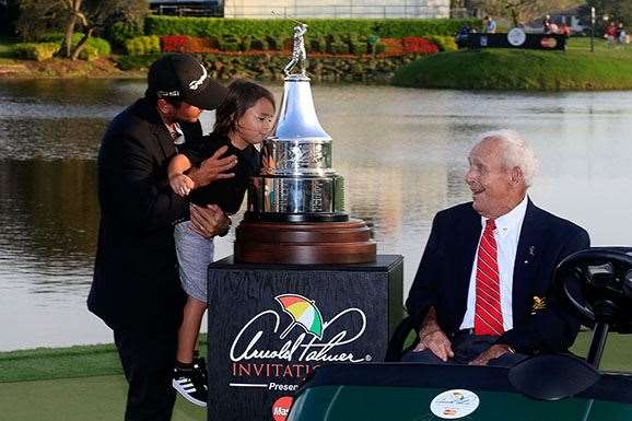'The King' has a laugh as Day holds up his son, Dash, to kiss the trophy. PHOTO: Chris Trotman/Getty Images.