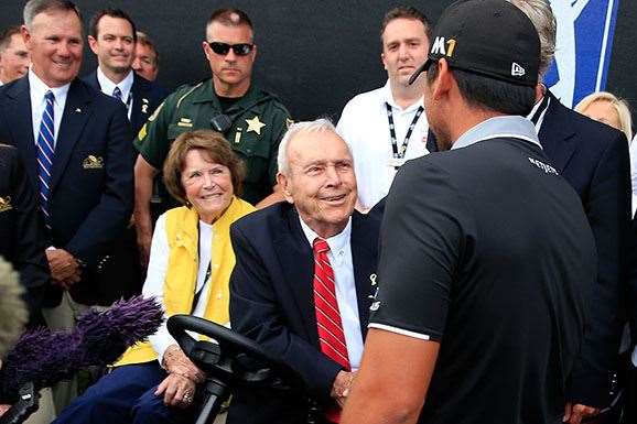 Day stops to shake hands with the great Arnold Palmer following his final round. PHOTO: Chris Trotman/Getty Images.