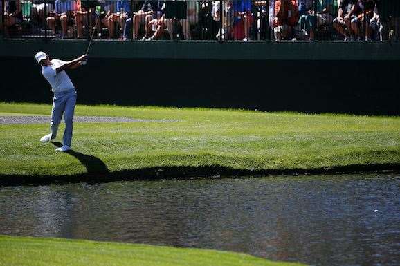 Jason Day skips a shot across the water on the 16th hole during a practice round. PHOTO: Kevin C. Cox/Getty Images.