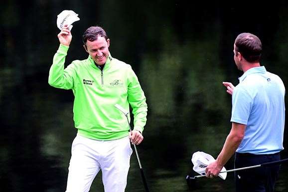 Jimmy Walker is congratulated by Harris English after winning the Par 3 Contest. PHOTO: Harry How/Getty Images.