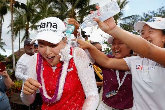 Minjee Lee has water dumped on her by Japan's Haru Nomura and South Korea's Sei Young Kim after her victory. PHOTO: Christian Petersen/Getty Images.