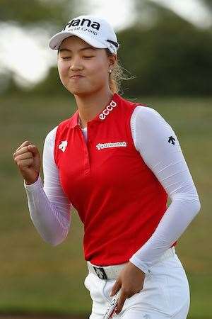 Job done: Lee celebrates a birdie putt on the 17th hole. PHOTO: Christian Petersen/Getty Images.