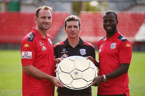 Eugene Galekovic, Guillermo Amor and Bruce Djite receive the A-League Premiers Plate. (Photo by Getty Images).