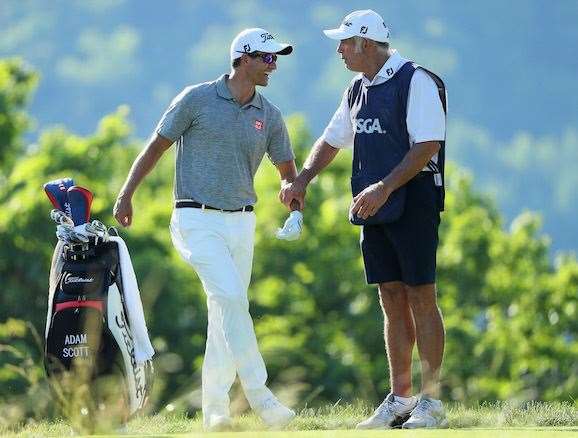 A relaxed Scott has a laugh with caddie Steve Williams midway through the second round. PHOTO: Andrew Redington/Getty Images.