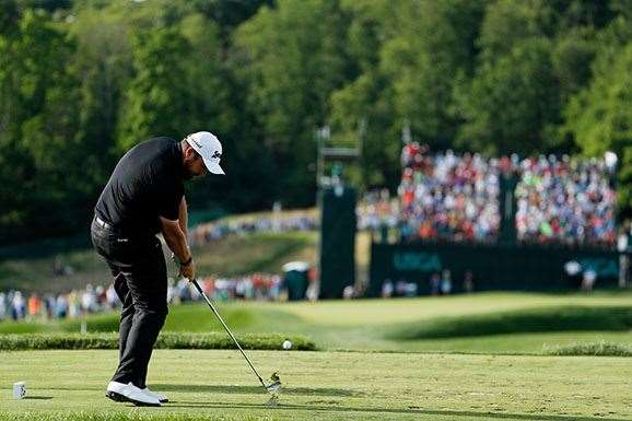 Shane Lowry will have to complete four holes when third round play resumes on Sunday morning (local time). PHOTO: Christian Petersen/Getty Images